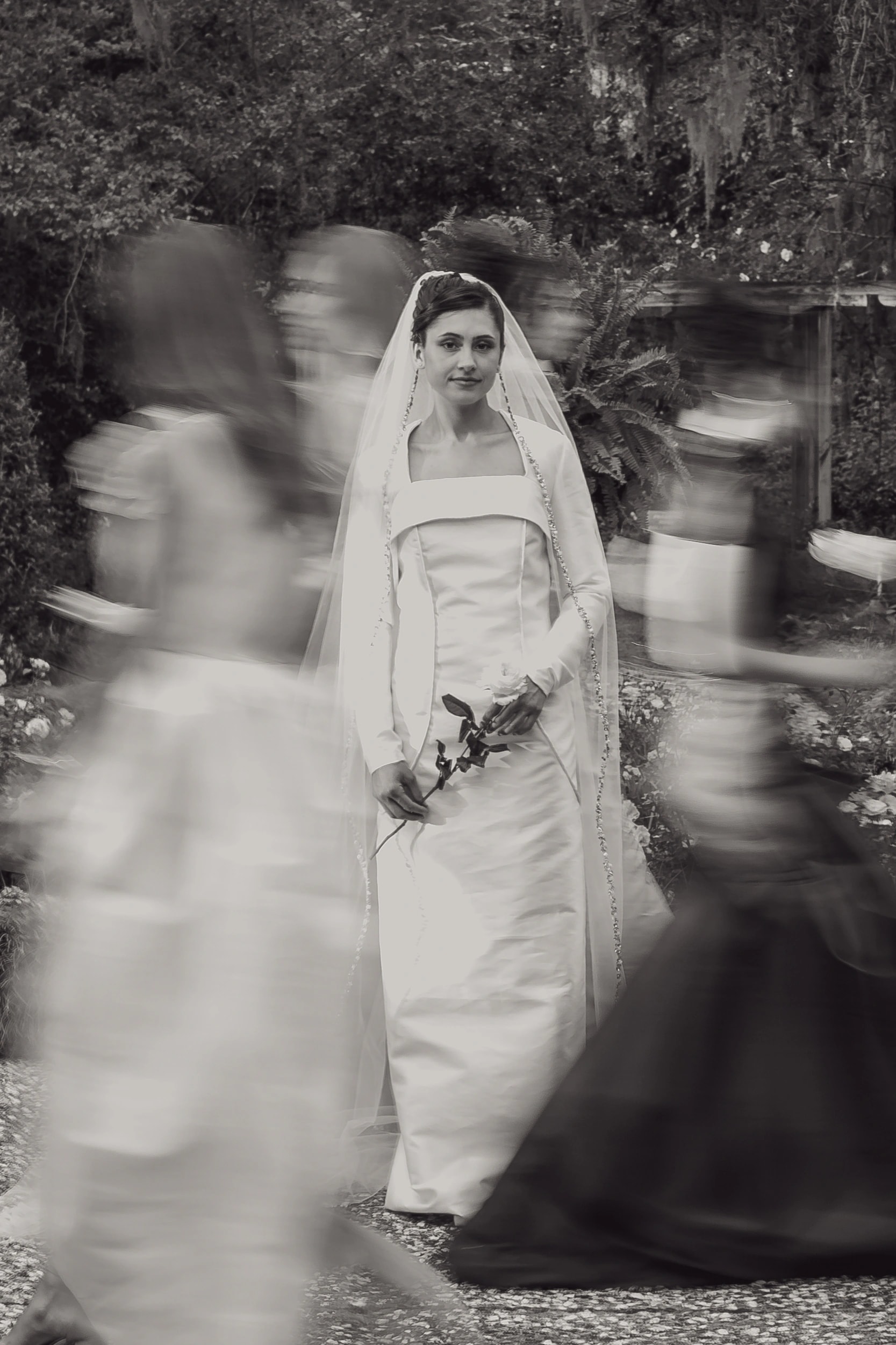 Bride in The Niah square-neck column wedding dress surrounded by soft motion