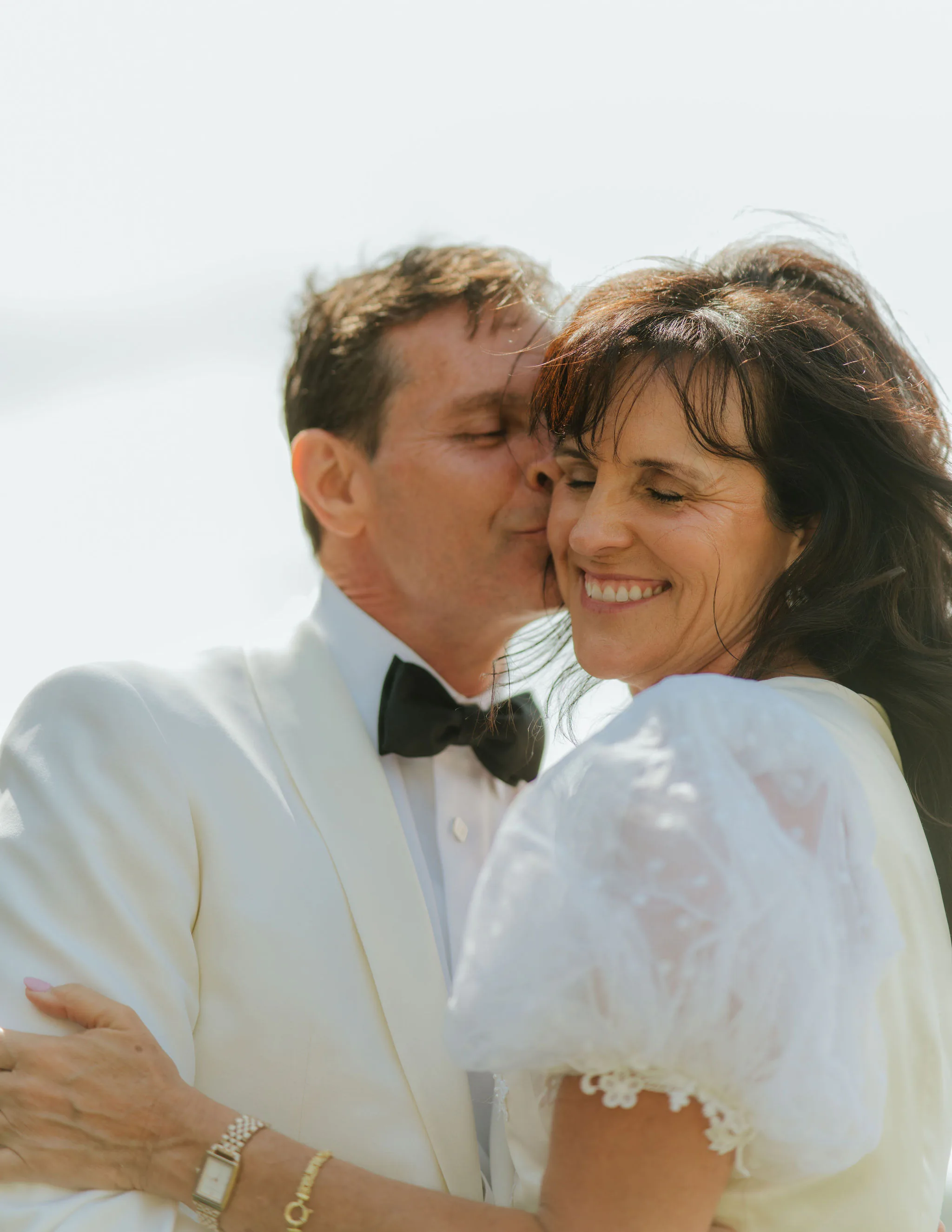 A close portrait of Samantha Covey's parents embracing during their 40 year vow renewal.